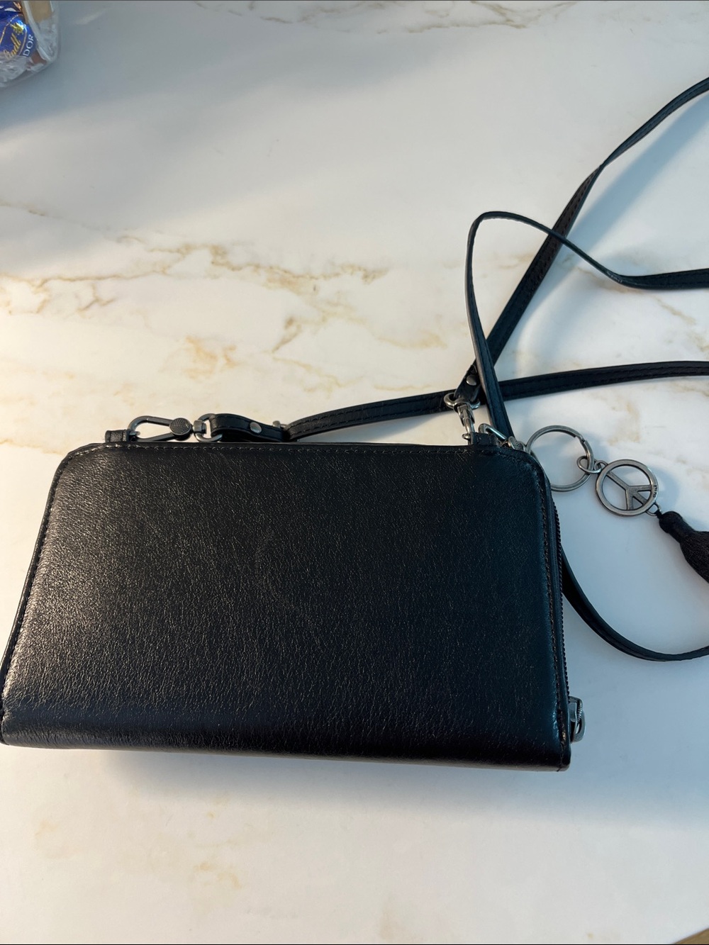 The Sak Black Leather Crossbody Wallet with Tassel and Charm - Picture 2 of 8